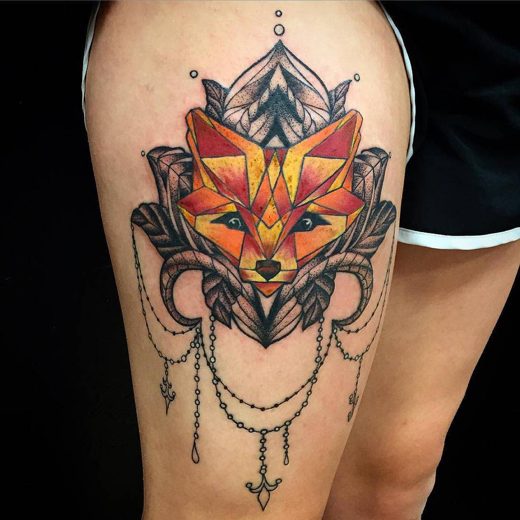 Geometric fox tattoo with intricate decorative elements on upper thigh