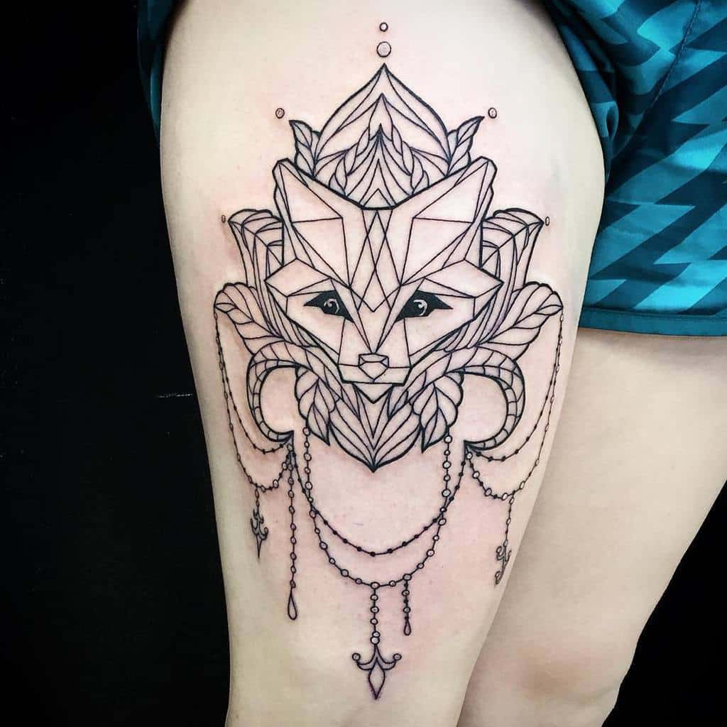 Geometric fox tattoo with ornate details and hanging jewels gracefully adorning the person's upper thigh