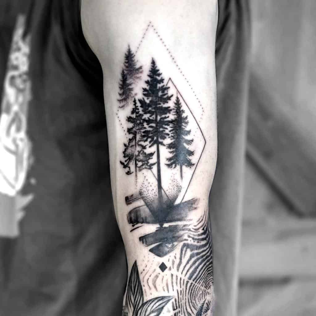 Black and grey tattoo of a geometric forest scene with tall pine trees, abstract shapes, and fine dotwork, blending nature and modern design.