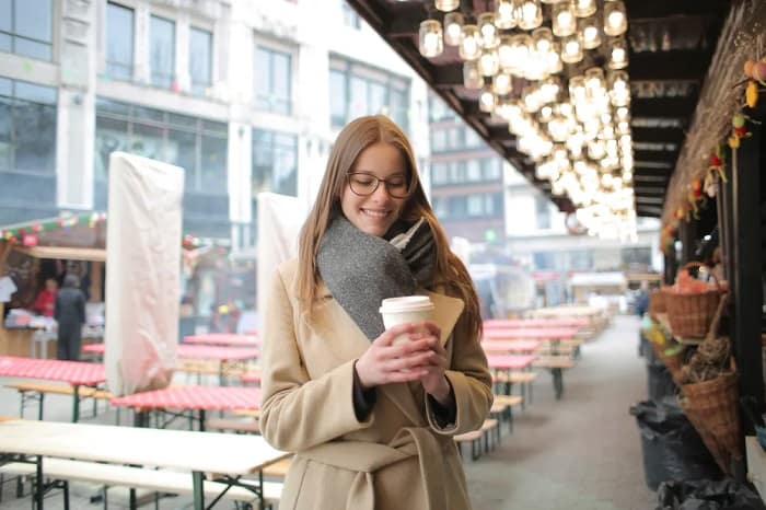 Girl At Market Holding Coffee