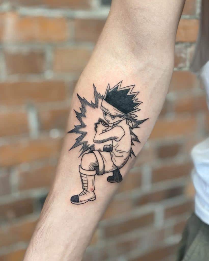 Dynamic black-ink tattoo of Gon Freecss from Hunter x Hunter, showcasing his fighting stance with an energy burst design on the forearm