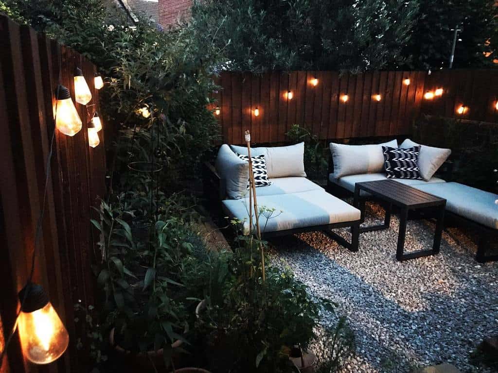 gravel patio with hanging lights