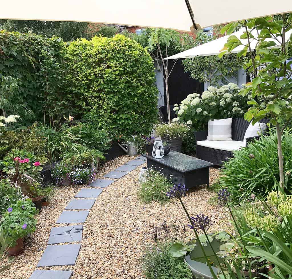 small gravel patio with wicker furniture 