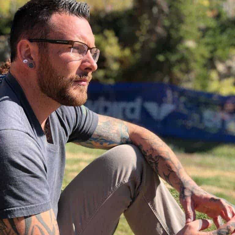 Bearded Guy In T-Shirt Wearing Glasses