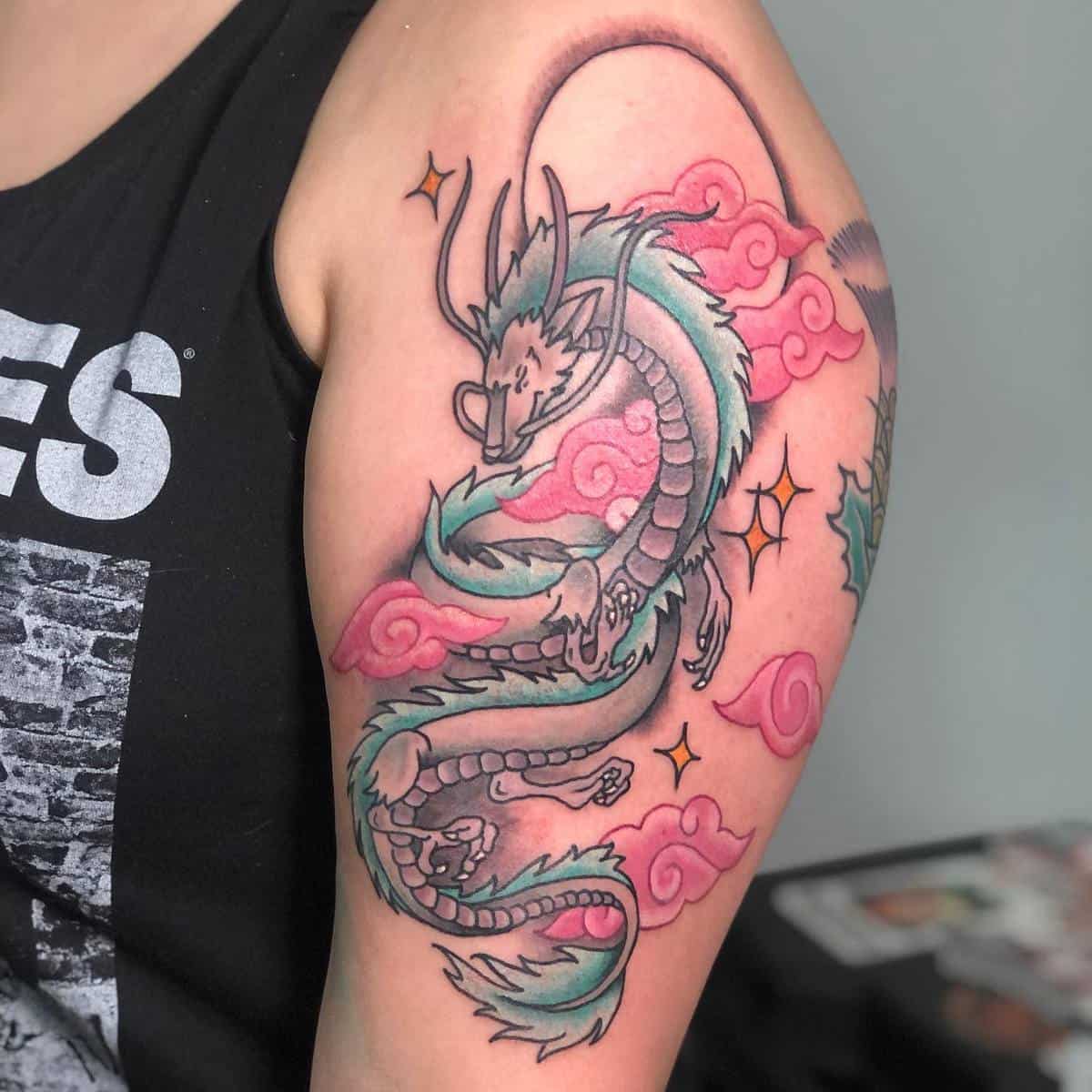 Haku tattoo from Studio Ghibli's Spirited Away, depicting the dragon with pink clouds