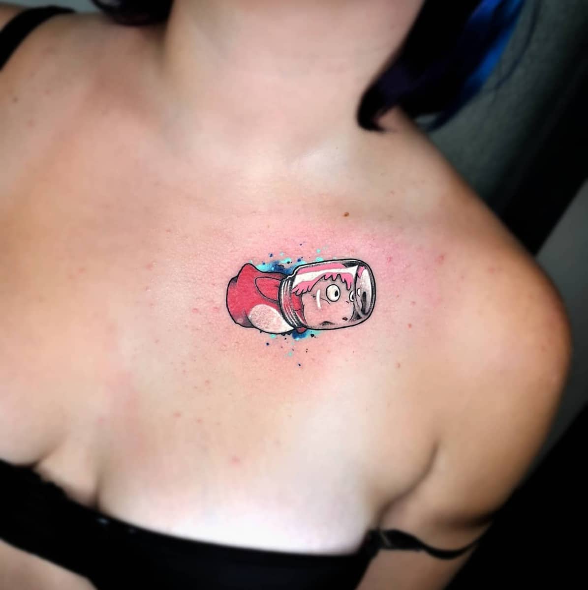 Small and colorful tattoo of Ponyo trapped in a jar from Studio Ghibli's Ponyo on the chest
