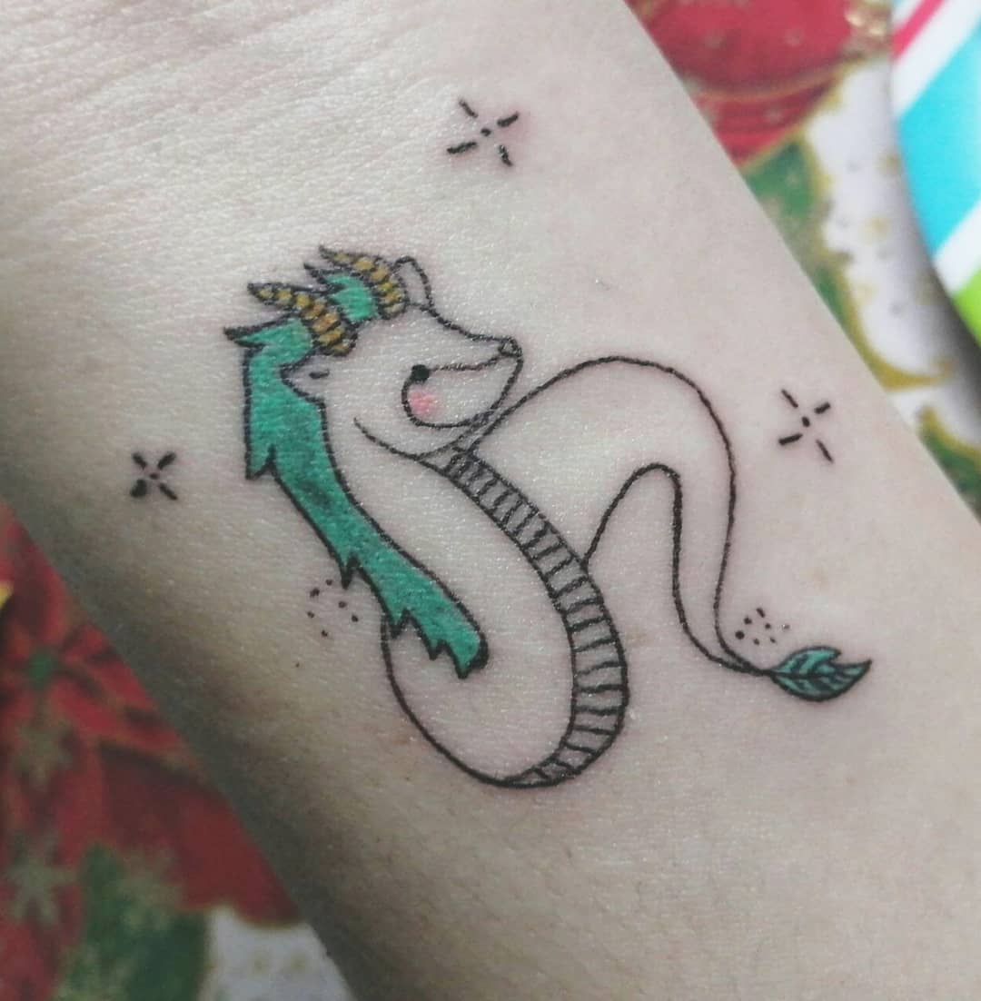 Cute and colorful tattoo of Haku from Studio Ghibli's Spirited Away with playful details