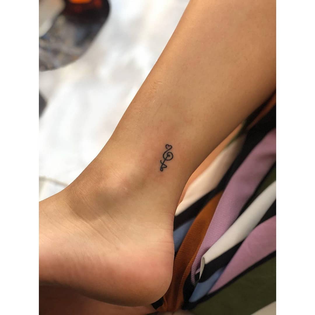 Hakuna Matata Symbol Tattoo on an Ankle