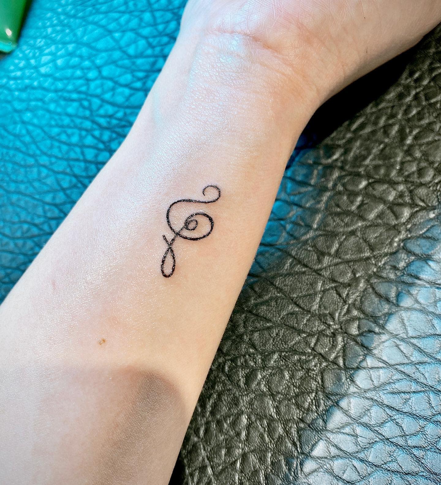 Hakuna Matata Symbol Tattoo on the Wrist