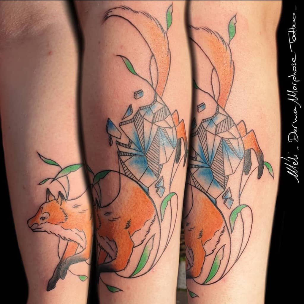 A geometric fox tattoo with orange and blue accents, blending organic shapes with crystals and leaves