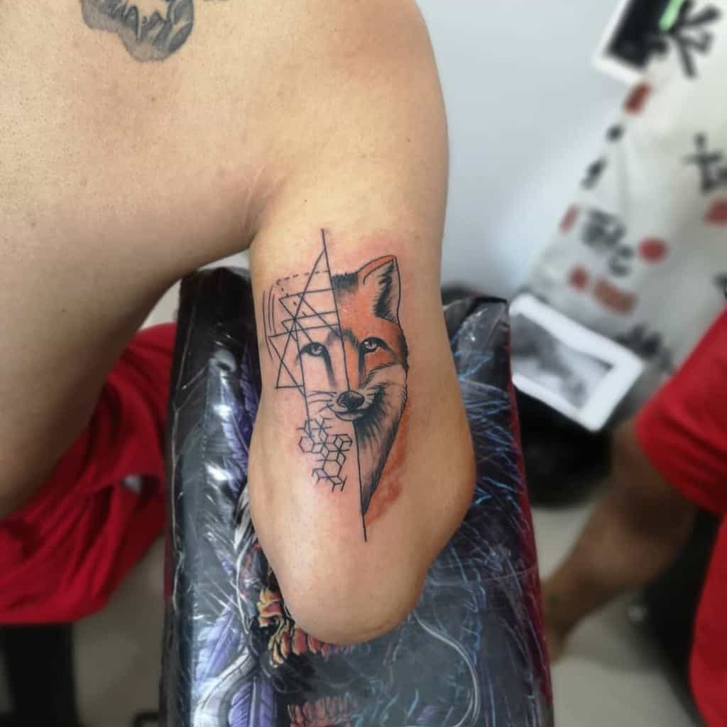 A half-realistic, half-geometric fox tattoo with bold lines, blending natural and abstract geometric patterns