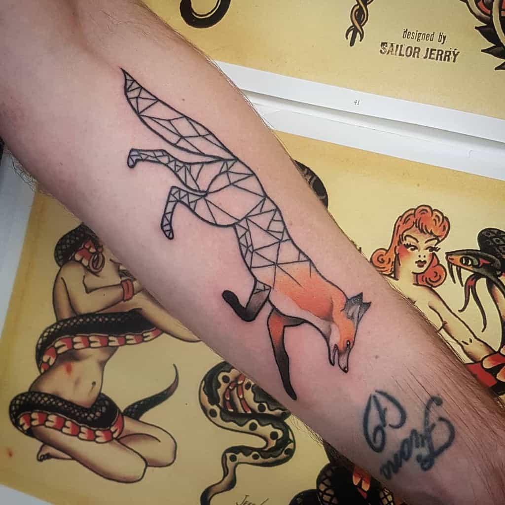 A geometric fox tattoo in a leaping pose, with the front half realistically shaded and the back in angular geometric lines