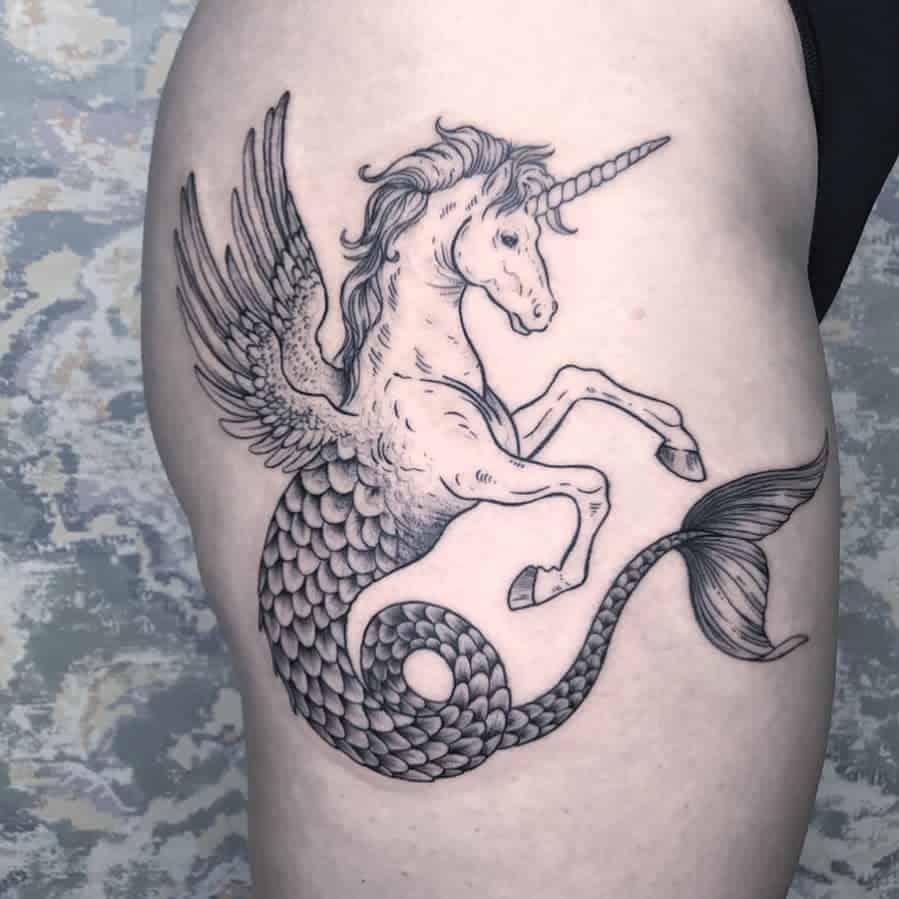 Black ink tattoo of a mythical hybrid creature combining a unicorn, pegasus, and mermaid, featuring wings, a horn, and a detailed fish tail.