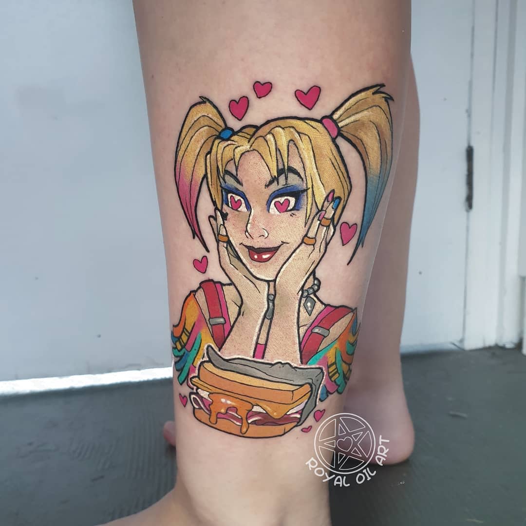 Colorful tattoo of Harley Quinn with heart eyes smiling with hands on cheeks loves sandwiches