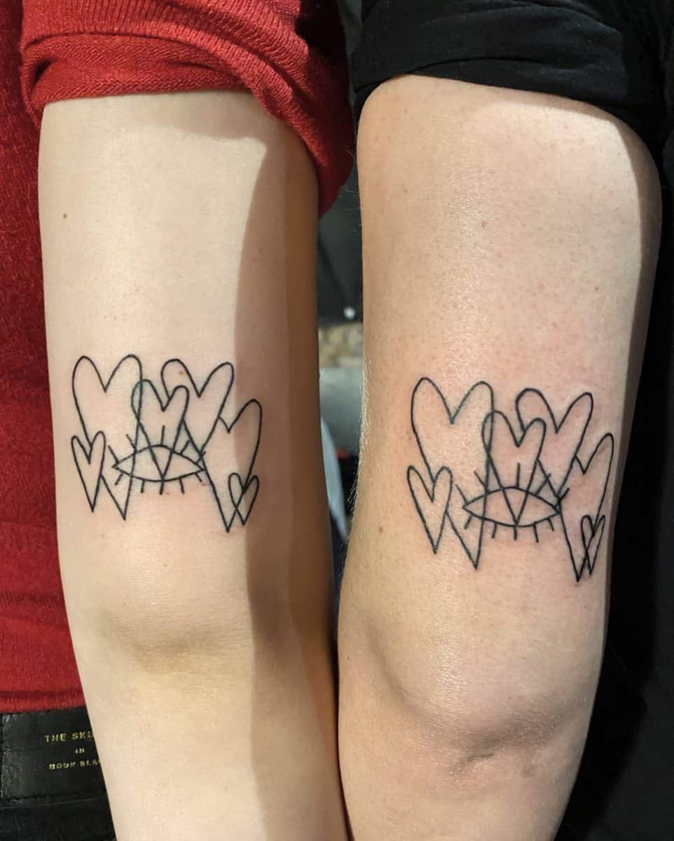 Matching line art tattoos of multiple hearts and geometric design on two arms