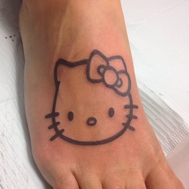 Hello Kitty tattoo on the top of a foot