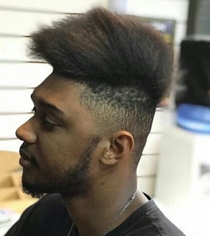 Hi Top Fade Haircut With Long And Messy Hair On Top Paired With A Clean Fade On The Sides And Back