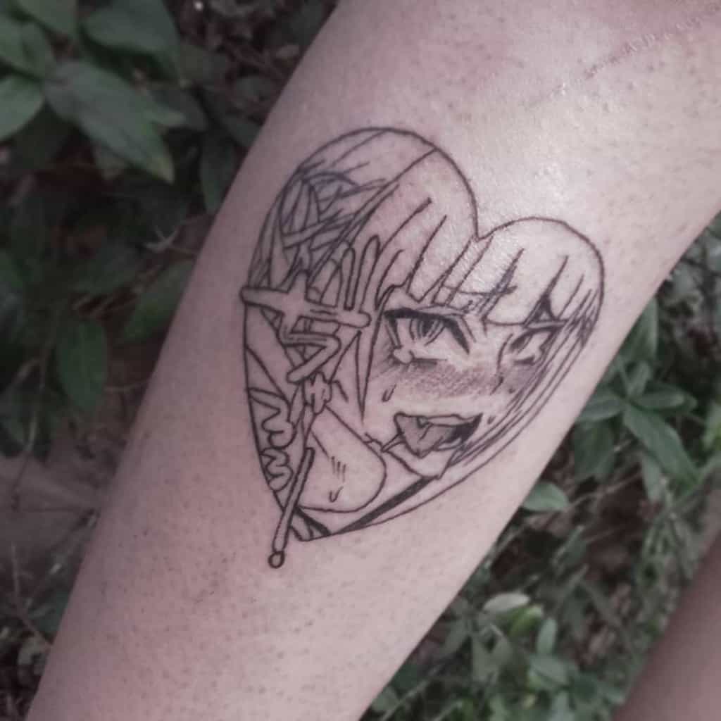 Black ink tattoo of Himiko Toga from My Hero Academia inside a heart shape, featuring her playful yet sinister expression with sharp teeth