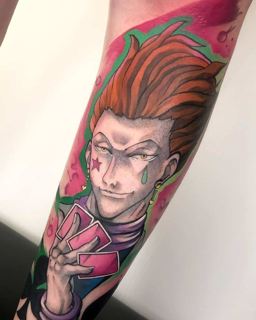 Bright and detailed Hisoka Morow tattoo from Hunter X Hunter, showcasing his cards, signature star and tear marks, and vibrant colors