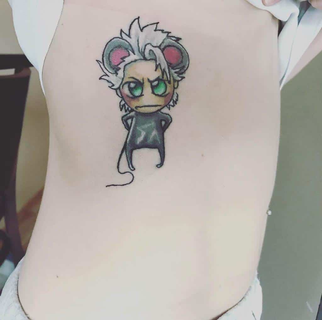 Chibi-style tattoo of Toshiro Hitsugaya from Bleach, depicted as a small mouse with green eyes and silver hair