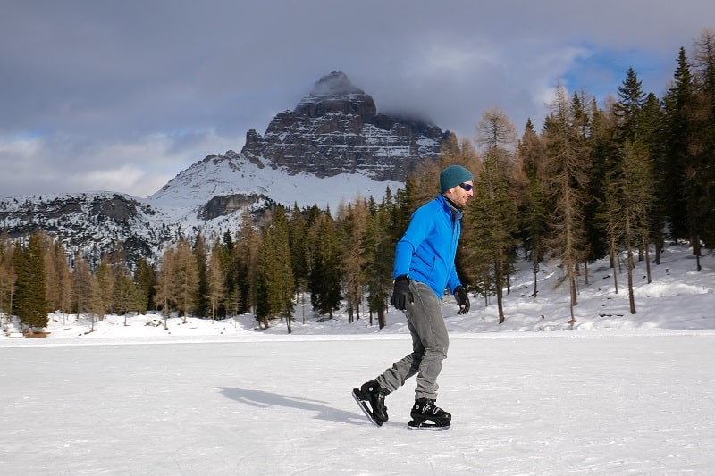 Young,Man,Skating,On,The,Iced,Lake,Antorno,,Near,Cortina