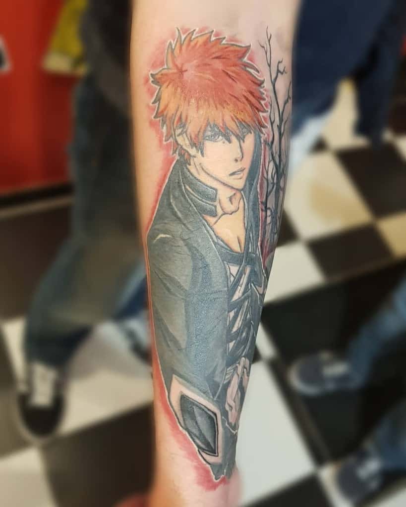 Colorful tattoo of Ichigo Kurosaki from Bleach, featuring his signature orange hair, black Shihakusho, and a red aura effect