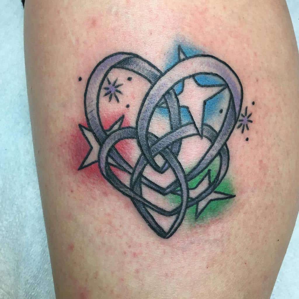 Tattoo of an infinity knot heart with stars and colored background