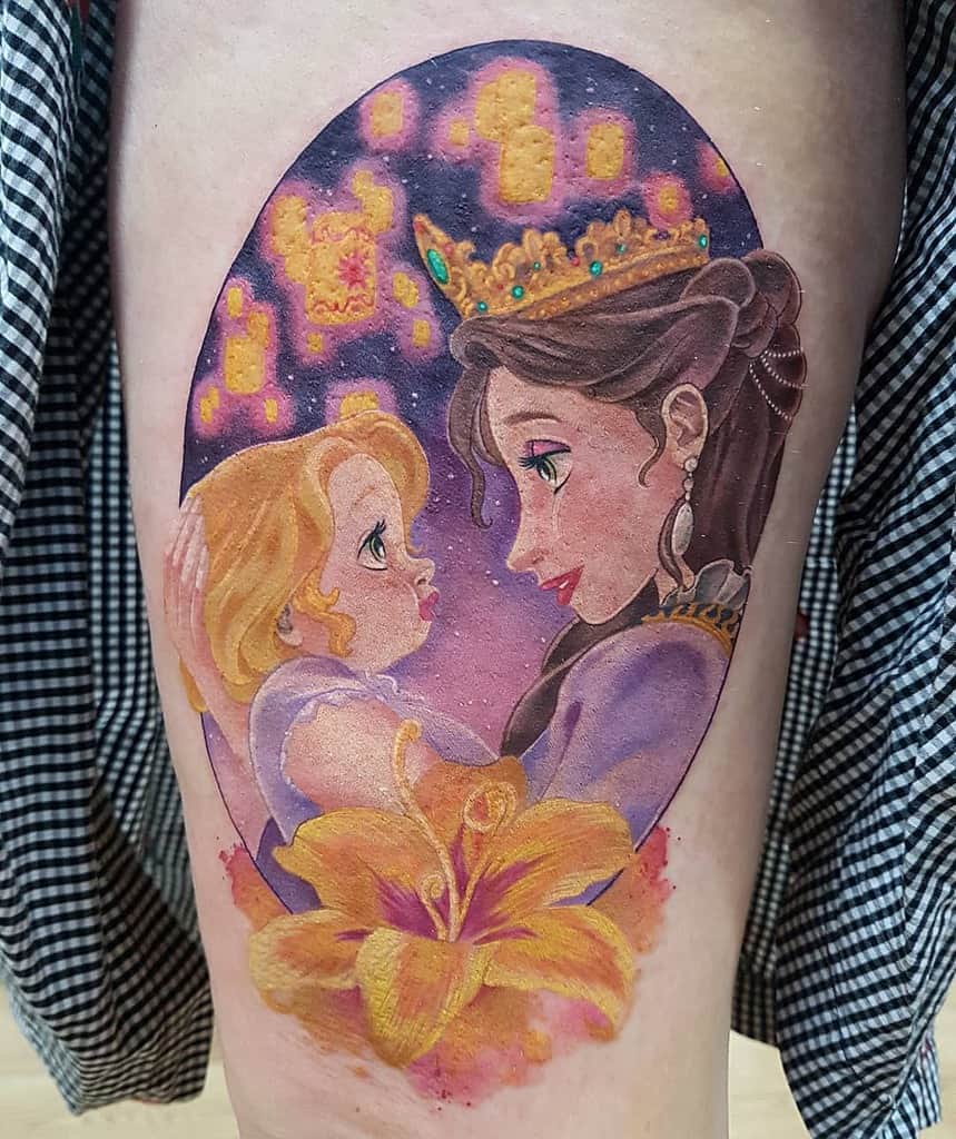 Colorful tattoo featuring Rapunzel and her mother from Tangled, surrounded by glowing lanterns with a golden lily and violet background