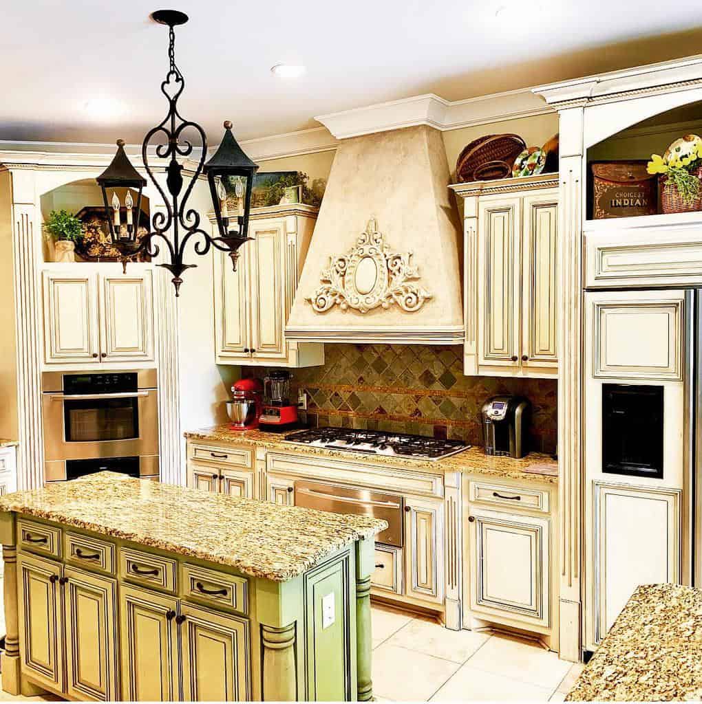 rustic style kitchen white cabinets lantern lighting gray and white granite countertop