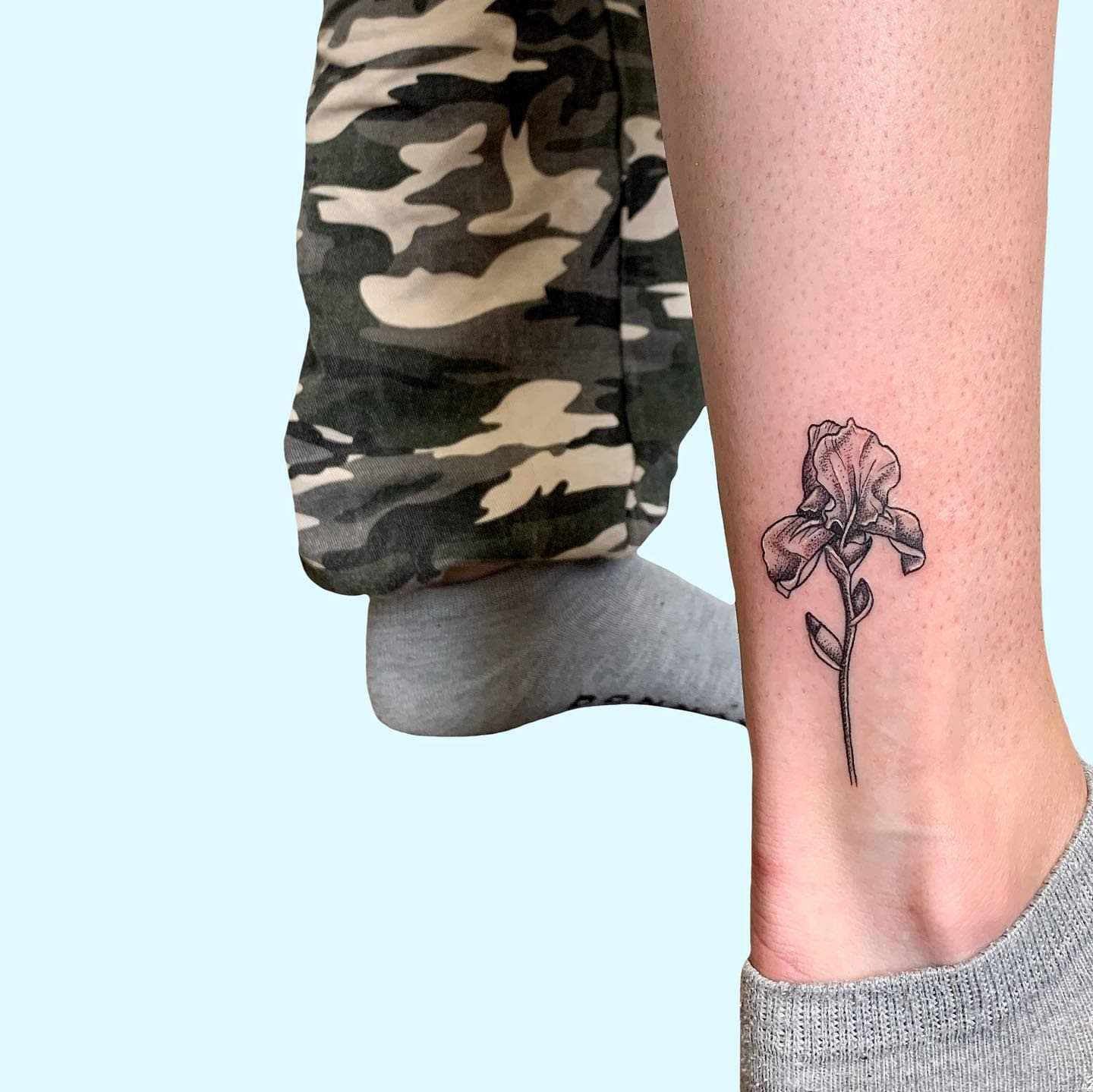 Ankle tattoo of an iris