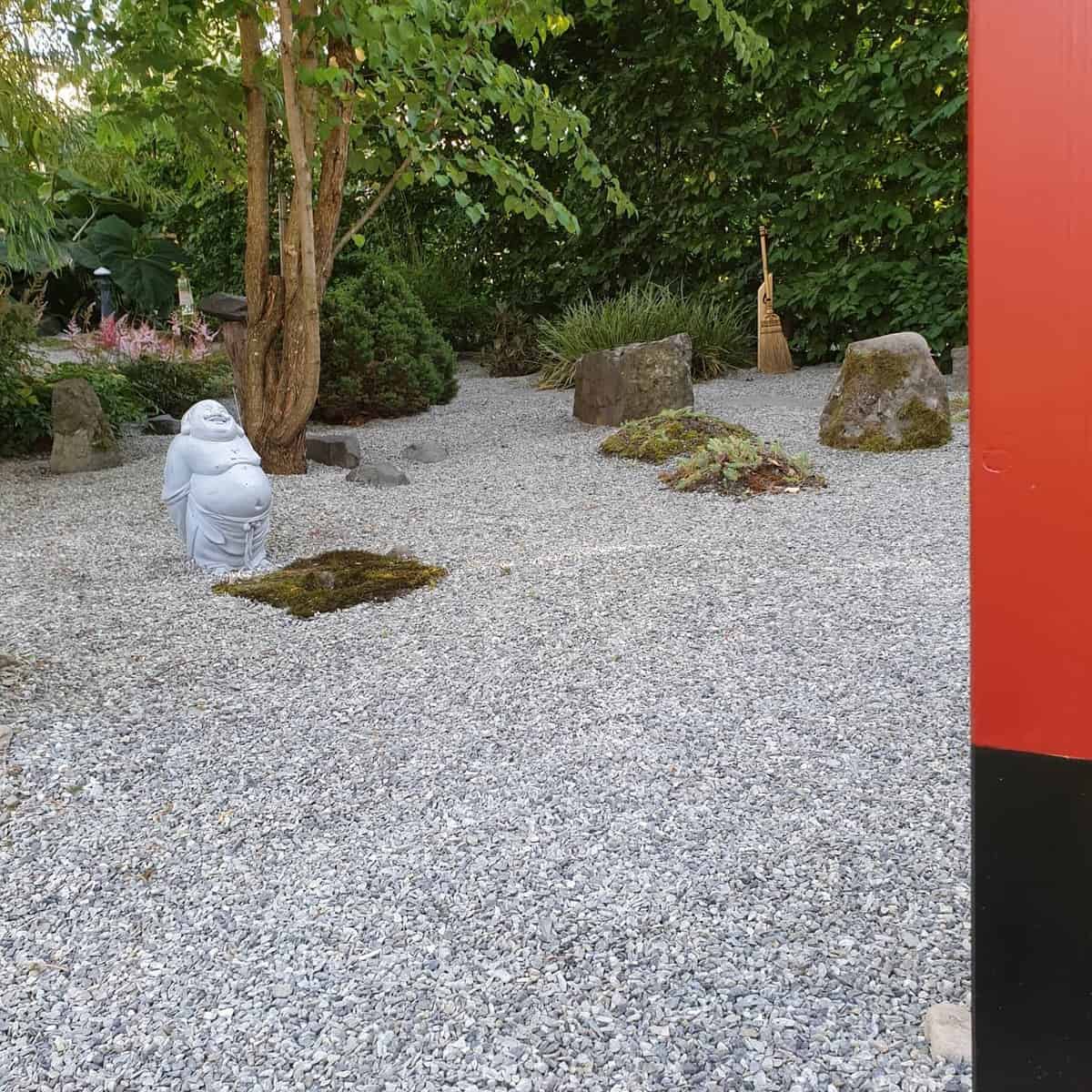 japanese garden white gravel buddha statue 