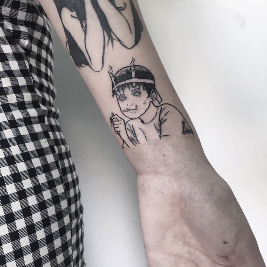 Wrist tattoo of Souichi from Junji Ito, depicted with his signature nails and eerie expression