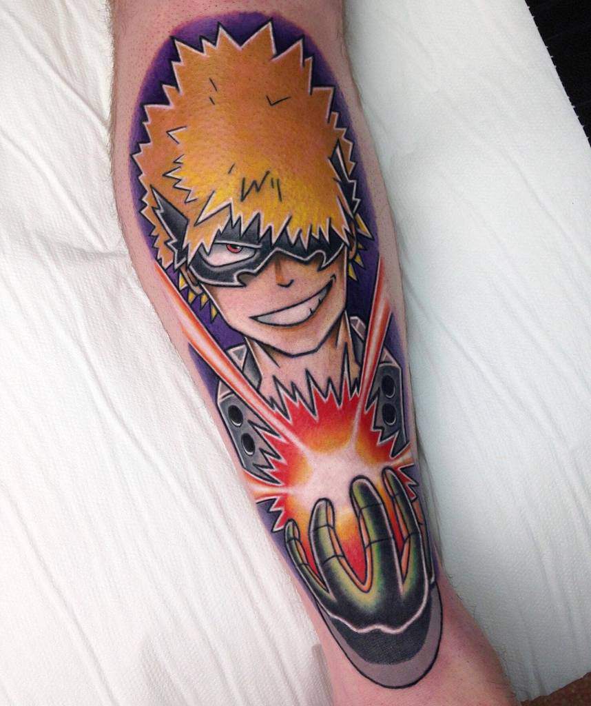Bold and colorful tattoo of Katsuki Bakugo from My Hero Academia, smirking while unleashing an explosion, with a vibrant purple background