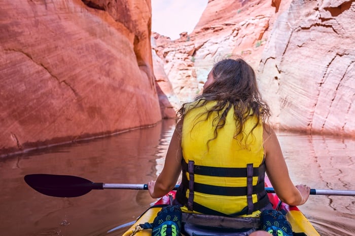 Girl Kayaking In Canyon