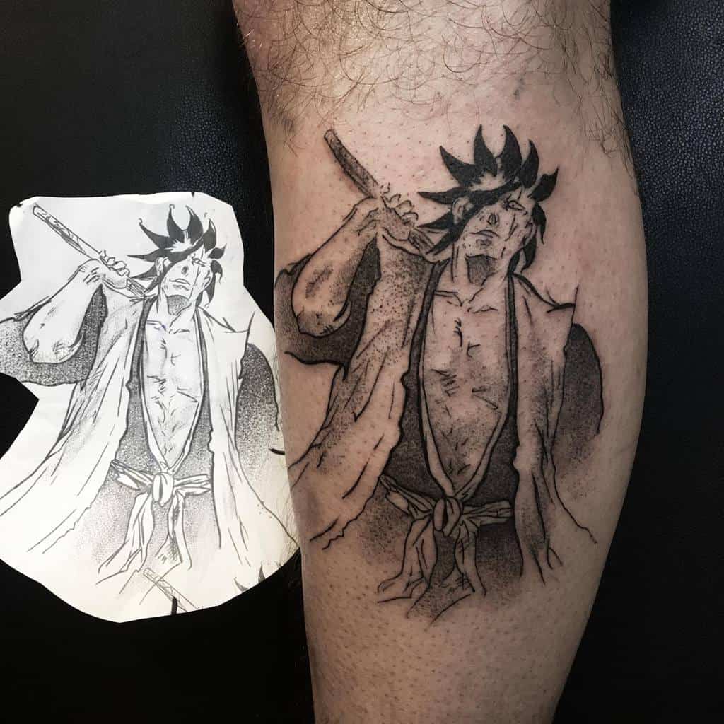 Black and grey tattoo of Kenpachi Zaraki from Bleach, featuring his wild hair, open robe, and relaxed sword stance, with detailed manga-style shading