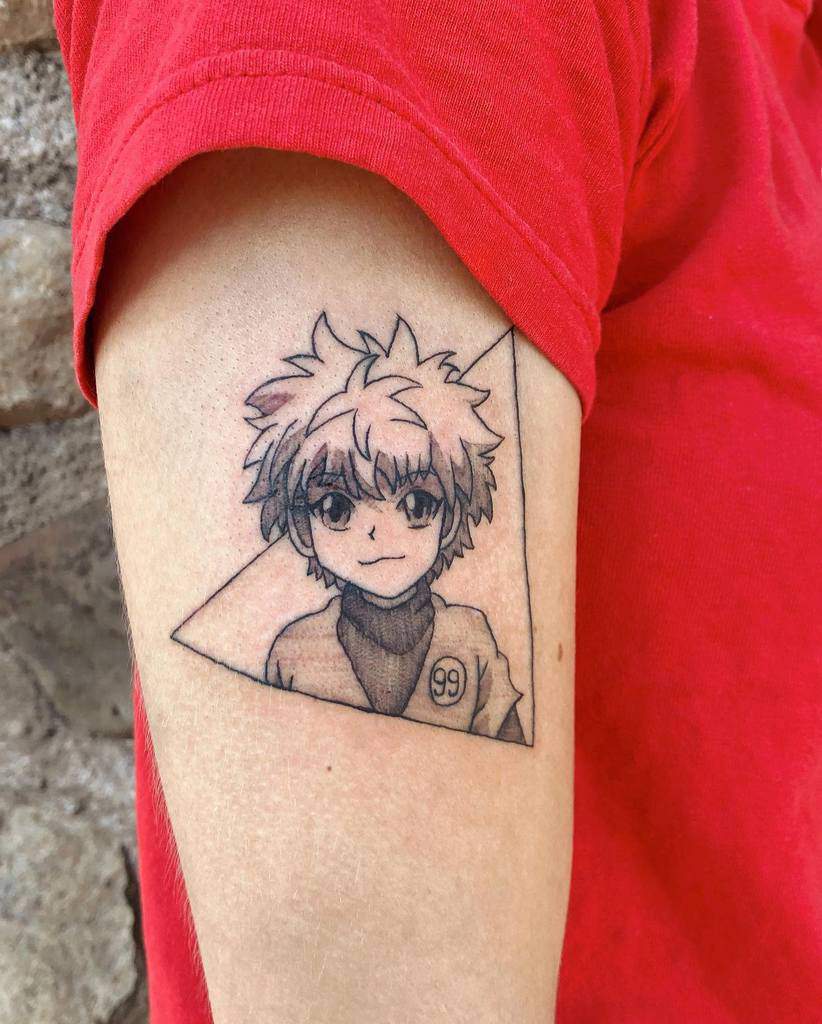 Stylish Killua Zoldyck tattoo from Hunter X Hunter, featuring a clean geometric design and his cheerful expression with the number 99