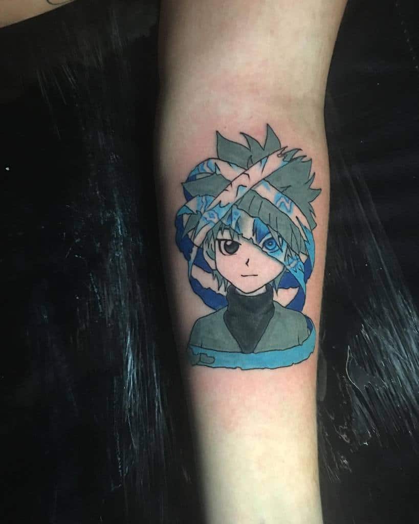 Colorful Killua Zoldyck tattoo from Hunter X Hunter, featuring his distinct hairstyle and blue eyes, with a dynamic, fragmented design