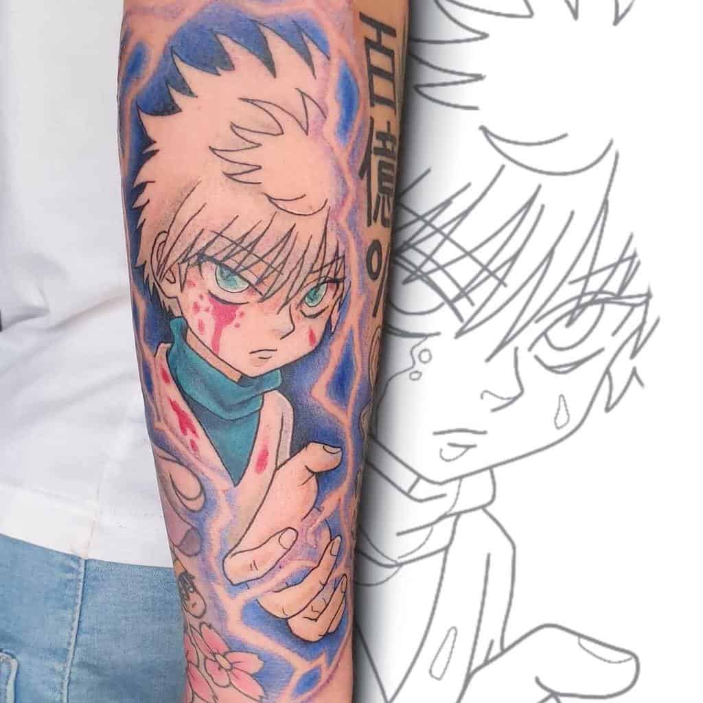 Vivid Killua Zoldyck tattoo from Hunter X Hunter, showcasing his intense expression with battle marks, glowing blue accents, and Japanese text