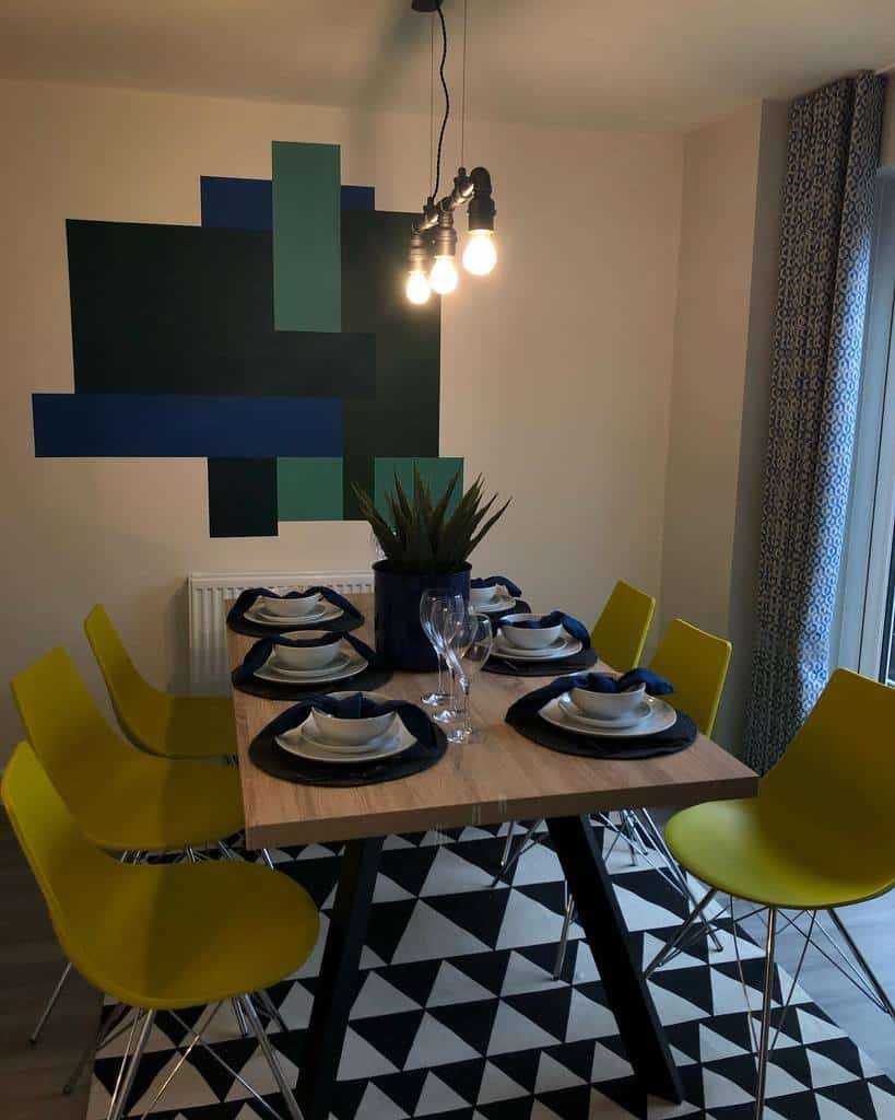 abstract dining room wall art dining table yellow chairs pendant lights