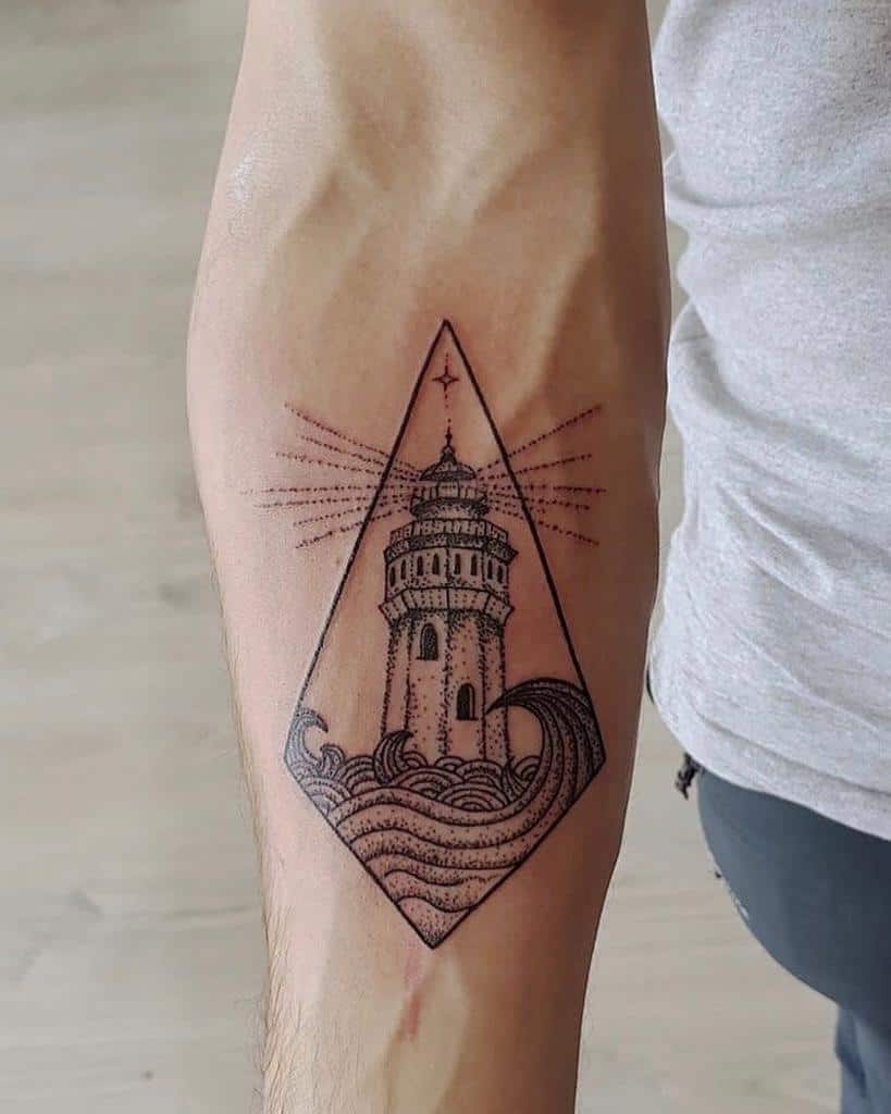 Black ink tattoo of a lighthouse standing on ocean waves, enclosed within a geometric diamond frame, with light rays extending outward