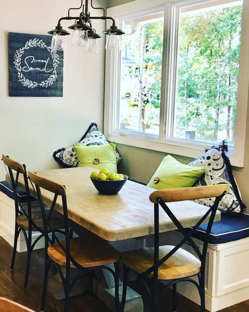 wood table and chairs bench seating pendant ceiling lights