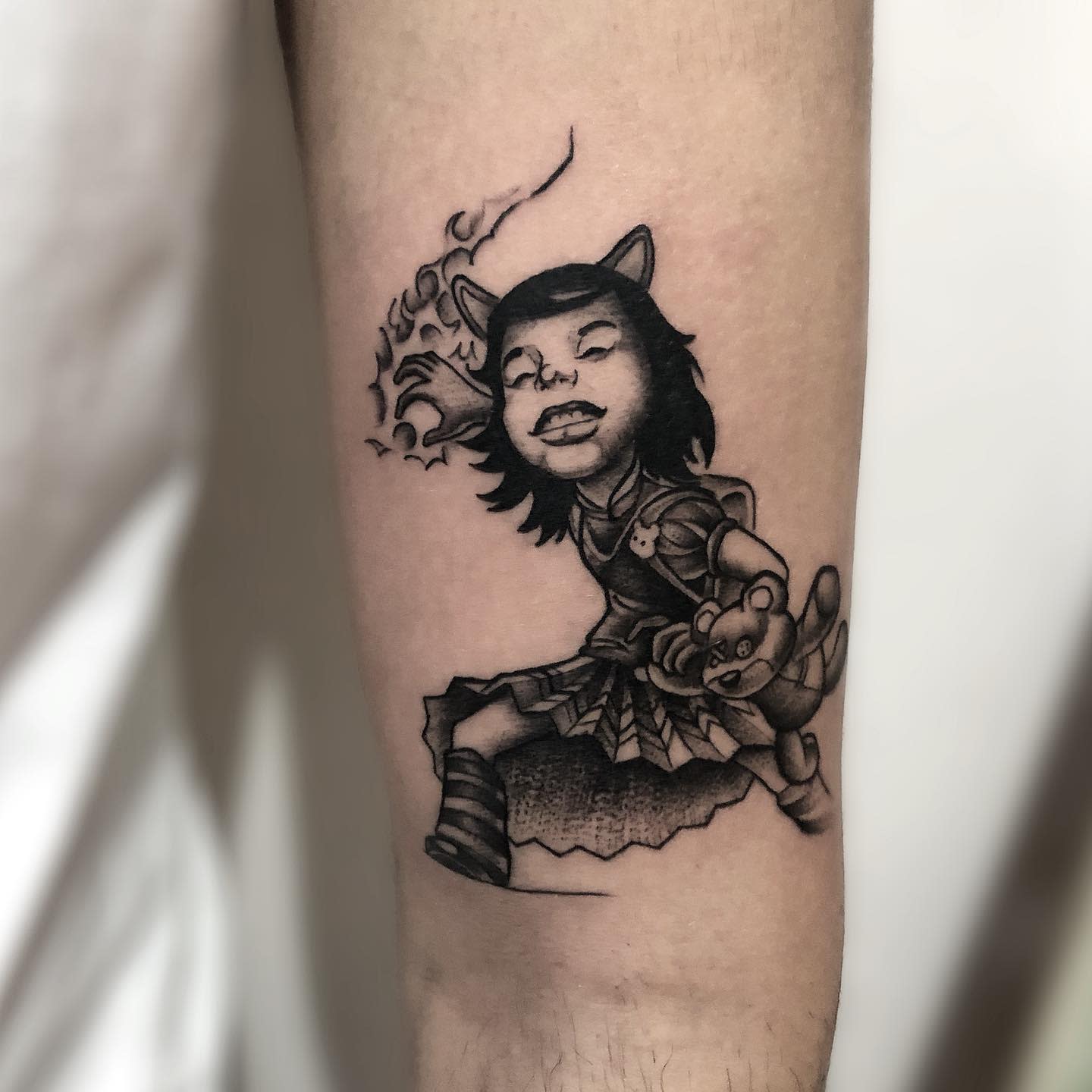 Black and white tattoo of Annie from League of Legends, casting a spell while holding her teddy bear Tibbers