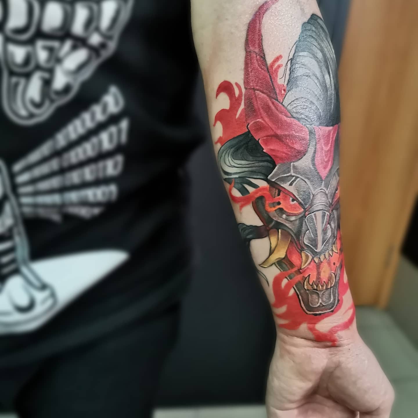 Colorful tattoo of Aatrox from League of Legends, with his fiery blade and menacing presence