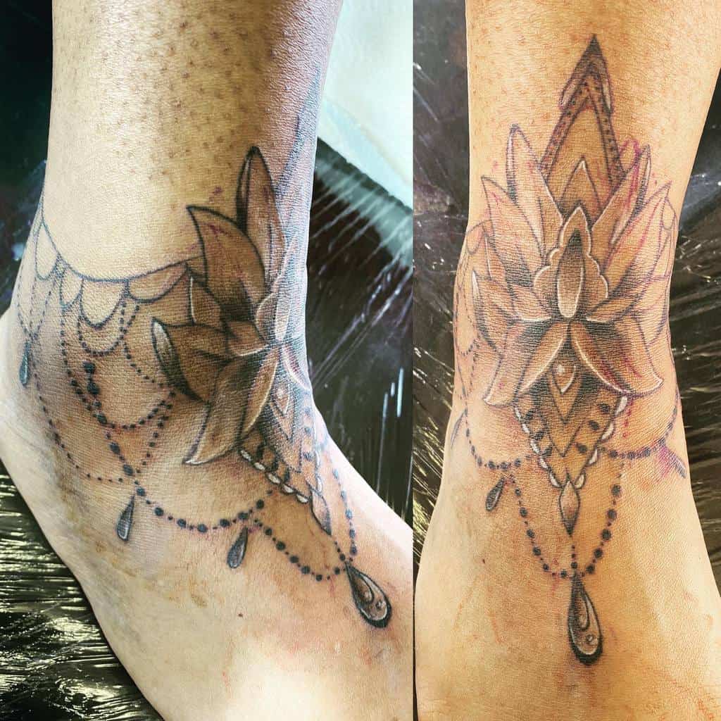 Elegant tattoo featuring a shaded lotus flower with intricate geometric patterns, chandelier-style beadwork, and teardrop accents, shown from two angles