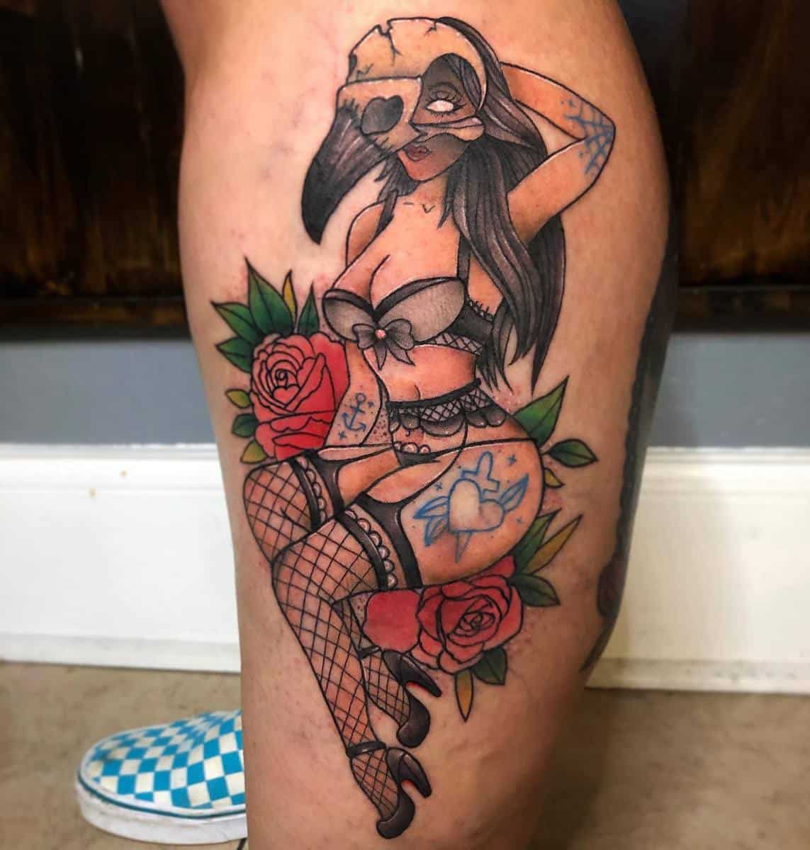 Tattoo of a masked woman in lingerie with roses, fishnet stockings, and heart symbols on thigh