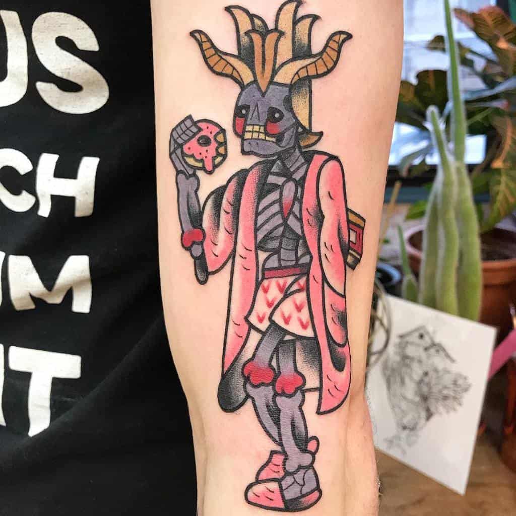 A playful tattoo of a lich wearing a pink robe with heart details, adorned with horns and a crown, holding a staff with a skull design
