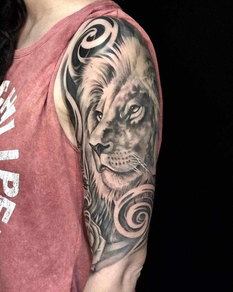 Lion tattoo on a woman's upper arm