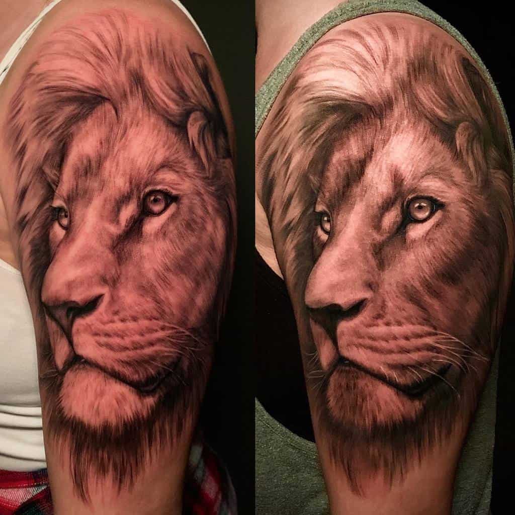 Detailed lion tattoo on an upper arm, showcasing realistic fur and facial features