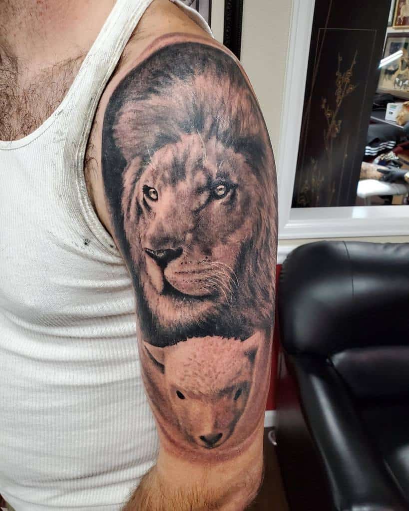 Lion and lamb tattoo on a man's upper arm, showcased in profile view as he wears a white tank top