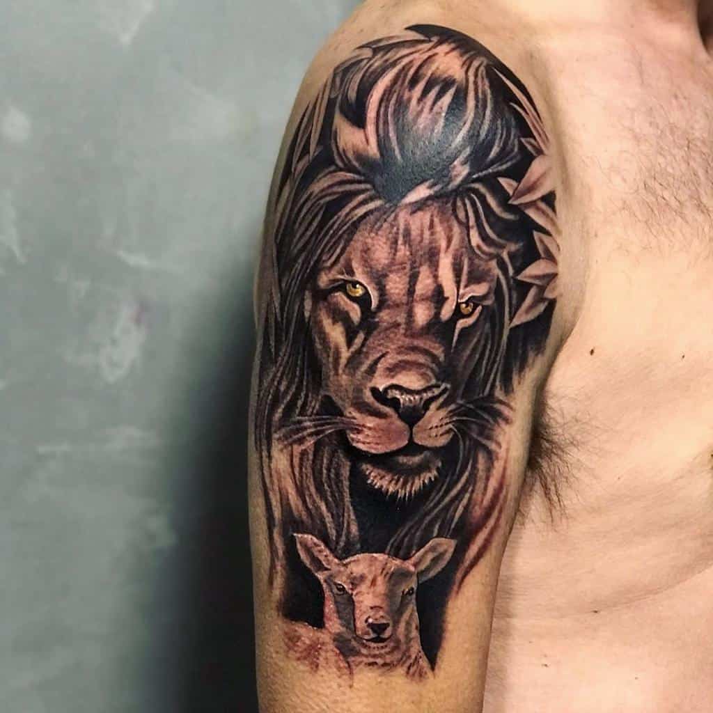 Tattoo of a majestic lion with a gentle lamb on a person's upper arm